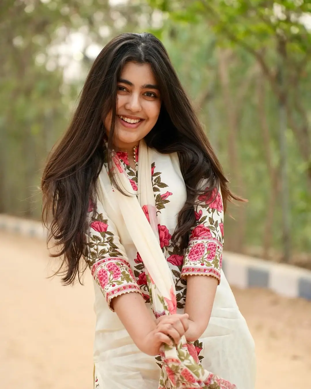 Gargeyi Yellapragada Smiling Face Long Hair White Dress